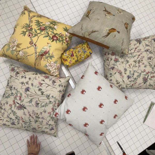 Upholstery workshop group with completed projects