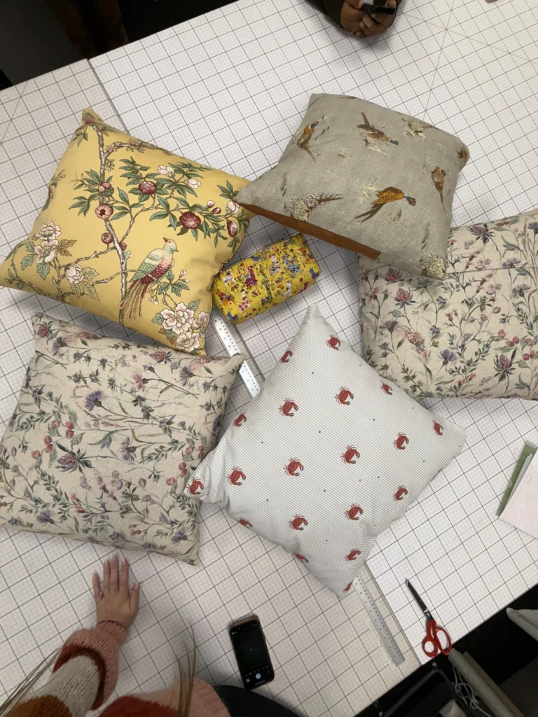 Upholstery workshop group with completed projects