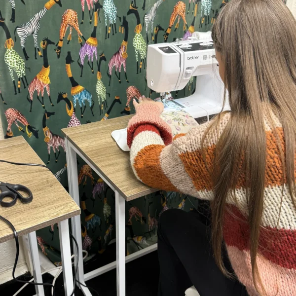 Upholstery workshop group working on chair restoration