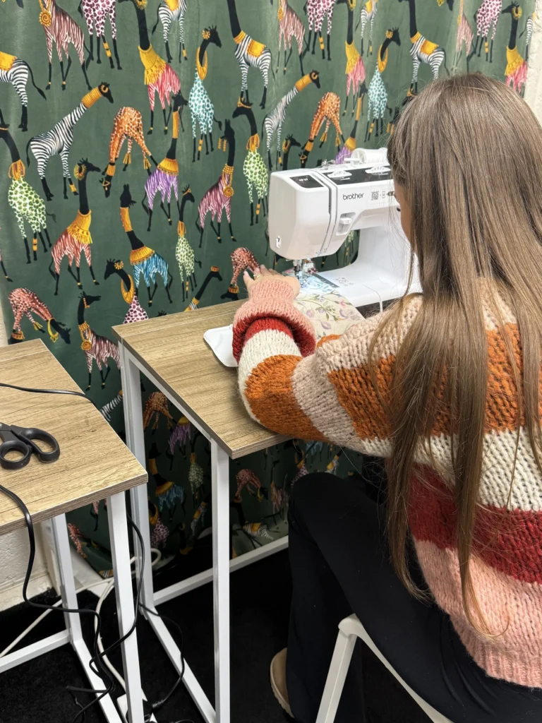 Upholstery workshop group working on chair restoration