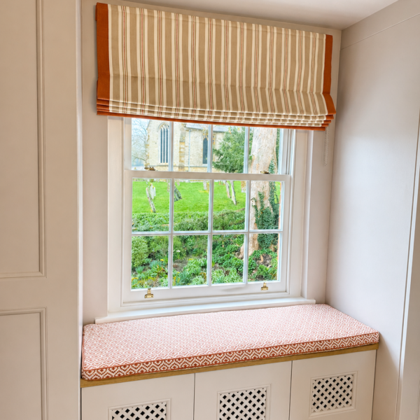 Bespoke window seat cushion with matching Roman blind by Creature Comforts Upholstery