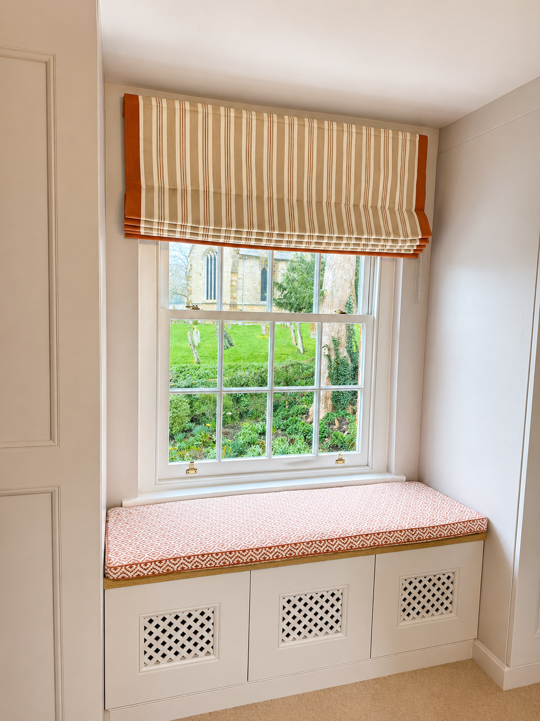Bespoke window seat cushion with matching Roman blind by Creature Comforts Upholstery