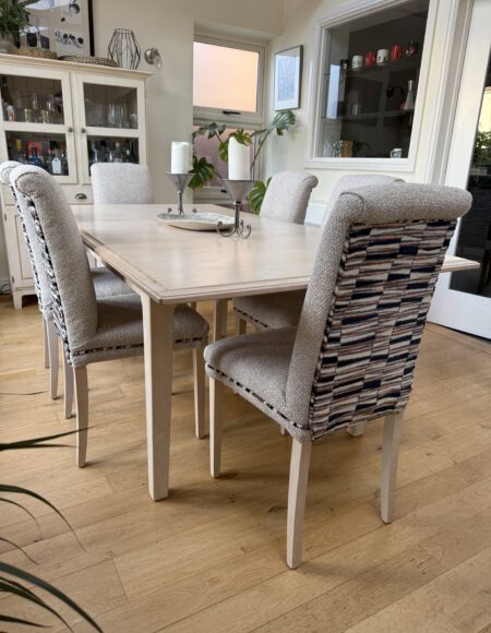 Dining chairs reupholstered with neutral seats and patterned backs by Creature Comforts Upholstery