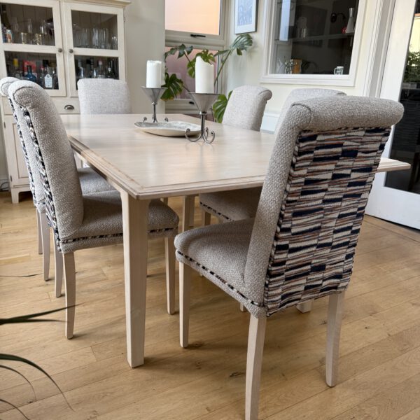 Dining chairs reupholstered with neutral seats and patterned backs by Creature Comforts Upholstery