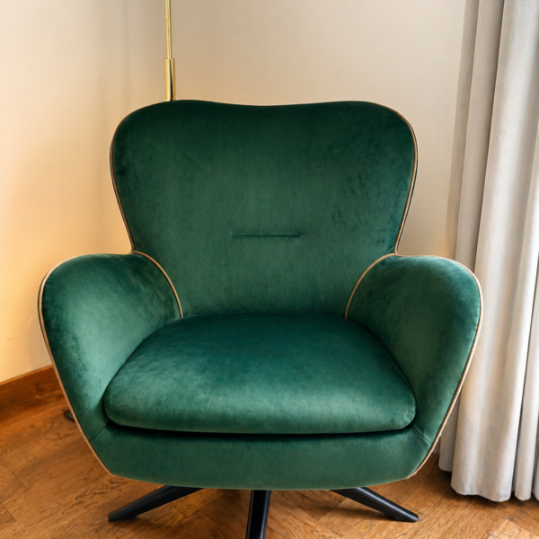 Green velvet chair reupholstered with contrast piping by Creature Comforts Upholstery