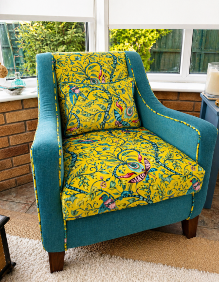 Yellow patterned accent chair reupholstered with a matching cushion