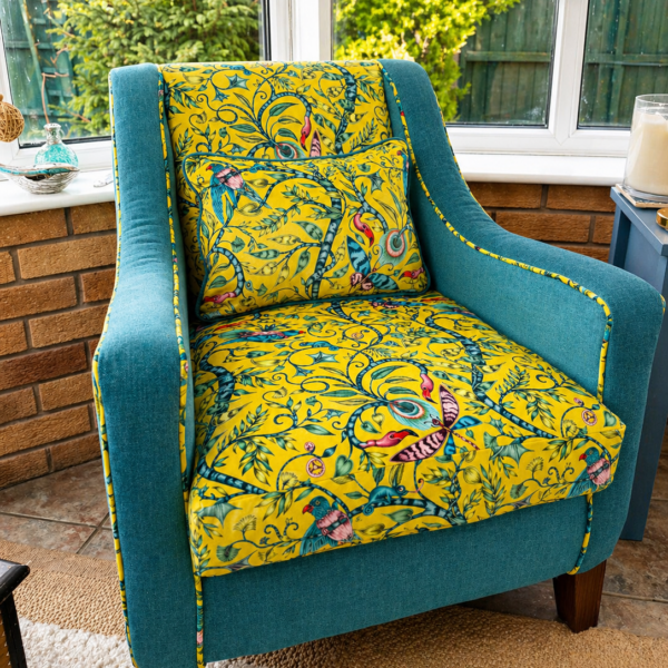 Yellow patterned accent chair reupholstered with a matching cushion
